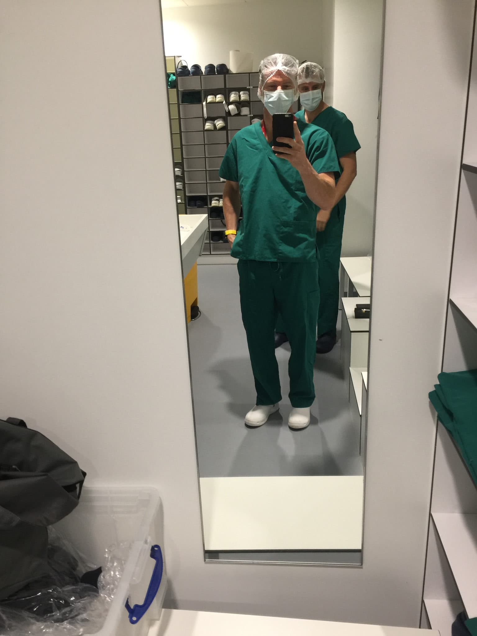 Scott in clinical lab protective clothing during COVID lab review work